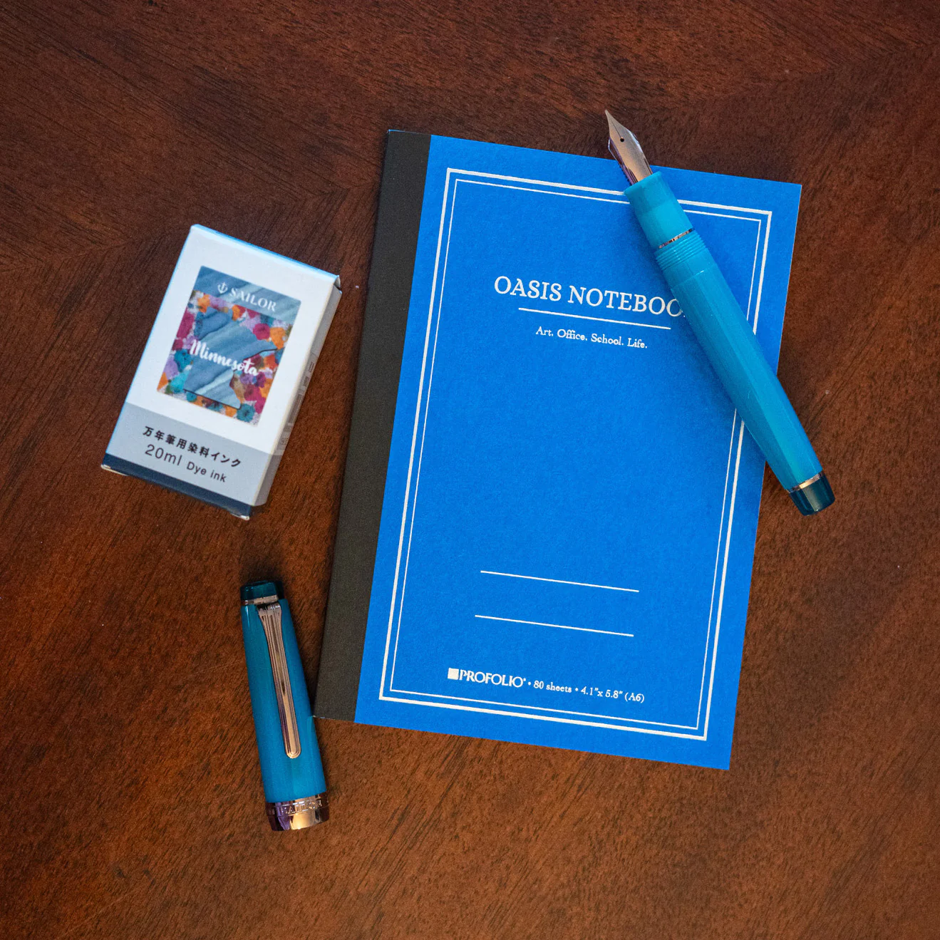 1893-sailor-pro-gear-regular-fountain-pen-in-lucky-charm-2-translucent-clover-teal-4.webp Sailor Pro Gear Regular Fountain Pen in Lucky Charm 2 Translucent Clover Teal